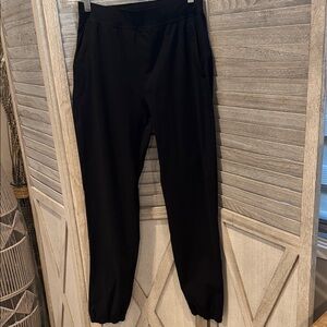 28.Lululemon womens joggers Zip bottom Black size 4 pre owned, pull on pre owned